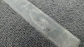 Kia K5 21-26 black fabric floor mat, front right, with worn lettering