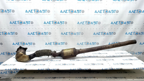 The exhaust pipe with catalytic converters on a VW Tiguan 09-18 has a torn mesh.