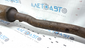 The exhaust pipe with catalytic converters on a VW Tiguan 09-18 has a torn mesh.