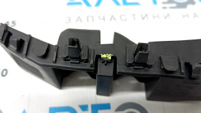 The front bumper mount on the right fender of a Kia Niro 23-26 is broken.