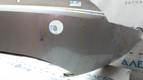 The bare lower rear bumper of a Volvo XC90 16-26 for parking sensors, without one parking sensor mount, white, scratches