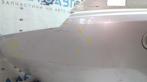 The bare lower rear bumper of a Volvo XC90 16-26 for parking sensors, without one parking sensor mount, white, scratches