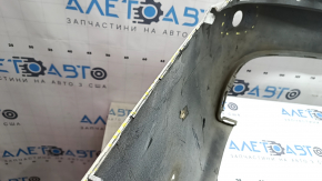 The bare lower rear bumper of a Volvo XC90 16-26 for parking sensors, without one parking sensor mount, white, scratches