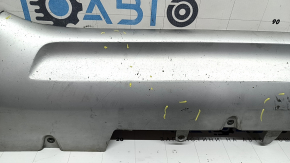 The front bumper lip of the Volvo XC90 16-19 is worn and scratched.