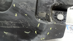 The front left underbody protection of the Volvo XC90 16-26 is worn and torn.
