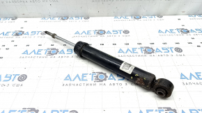 The rear right shock absorber of the Nissan Rogue 21-23 is dented.