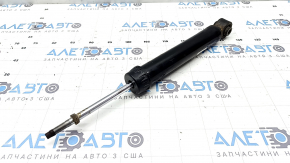 The rear right shock absorber of the Nissan Rogue 21-23 is dented.