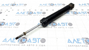The rear left shock absorber of the Nissan Rogue 21-23 is dented.