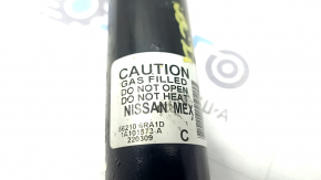 The rear left shock absorber of the Nissan Rogue 21-23 is dented.