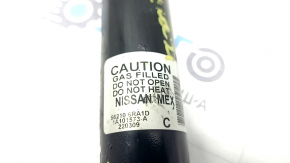 The rear right shock absorber of the Nissan Rogue 21-23 is dented.
