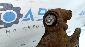 The rear left axle of a Toyota Prius 50 19-22 AWD is rusty, has a cut, and the bushing needs replacing.