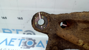 The rear left axle of a Toyota Prius 50 19-22 AWD is rusty, has a cut, and the bushing needs replacing.