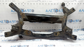 The rear subframe of a Toyota Prius 50 19-22 AWD is rusty, the inserts are torn off.