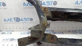 The rear subframe of a Toyota Prius 50 19-22 AWD is rusty, the inserts are torn off.