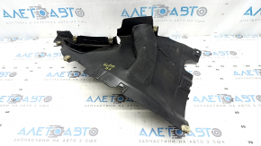 The front right fender liner, lower part, BMW X7 G07 19-26, is dented and has tears.