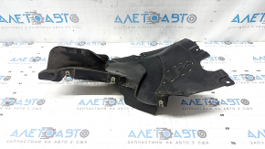 The front right fender liner, lower part, BMW X7 G07 19-26, is dented and has tears.