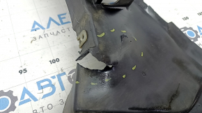 The front right fender liner, lower part, BMW X7 G07 19-26, is dented and has tears.