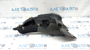 The front left fender liner, lower part, BMW X7 G07 19-26, is dented and has tears.