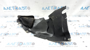 The front left fender liner, lower part, BMW X7 G07 19-26, is dented and has tears.