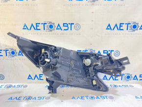 Left front headlight of a pre-restored Nissan Versa Note 13-16, scratched