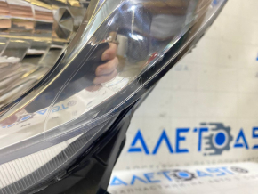 Left front headlight of a pre-restored Nissan Versa Note 13-16, scratched