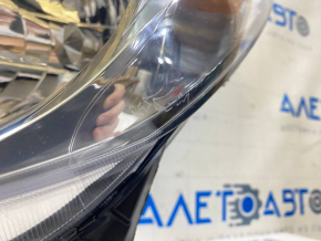 Left front headlight of a pre-restored Nissan Versa Note 13-16, scratched