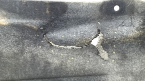 The left underbody protection of the BMW X3 G01 18-24 is dented and torn.