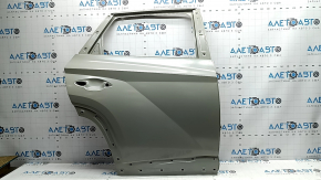 The bare rear right door of a Hyundai Tucson 22-24