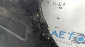 The rear left underbody protection of the BMW X3 G01 18-24 is dented.