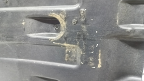 The rear right underbody protection of the BMW X3 G01 18-24 is dented and worn.