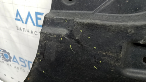 The rear right underbody protection of the BMW X3 G01 18-24 is dented and worn.