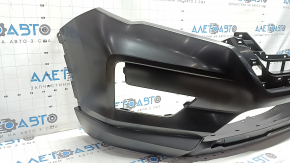 The front bumper of the Nissan Rogue 17-20 is dented.