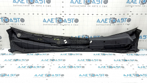 The plastic windshield wiper grille on a Hyundai Sonata 11-15 has a broken mount.