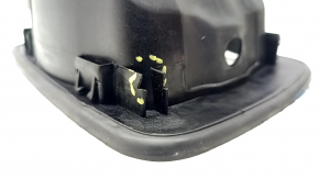 The fuel filler door housing of a Hyundai Sonata 11-15 has broken fasteners and a torn seal.