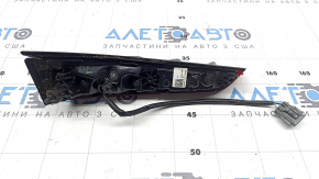 The right inner trunk lid light of a Hyundai Sonata 20-23 has broken glass.