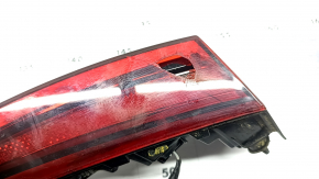 The right inner trunk lid light of a Hyundai Sonata 20-23 has broken glass.