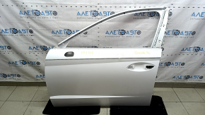 The front left door of a Hyundai Sonata 20-23, white, WC9, has dents.
