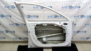 The front left door of a Hyundai Sonata 20-23, white, WC9, has dents.