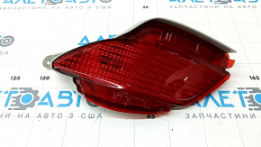 The left rear bumper light of a Lexus RX350 RX450h 10-15 has a broken lampshade.