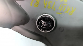 The left rear bumper light of a Lexus RX350 RX450h 10-15 has a broken lampshade.