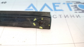 The right hood seal on a Mitsubishi Outlander 22-26 has torn fasteners.