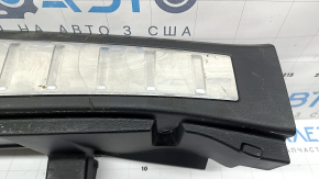 Mitsubishi Outlander 22-26 black trunk opening trim with chrome trim, with a plug for the lock hook, the chrome trim has peeled off, scratches