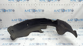 The rear left fender liner of a Kia Niro 17-19 HEV, PHEV, is dented, the fasteners are torn