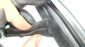 The front right door glass seal of the Land Rover Range Rover Velar 18-23 is torn.