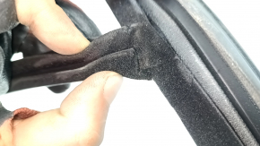 The front right door glass seal of the Land Rover Range Rover Velar 18-23 is torn.