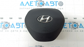The steering wheel airbag for the driver's side of the Hyundai Santa FE 19-23 is black and has a rusty squib.