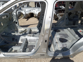 The central left body pillar of a Mitsubishi Outlander 22-26 is on the body, dented, and has bumps.