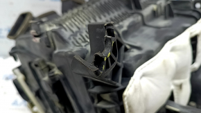 The bare heater housing of the Hyundai Santa FE 21-23 2.5, 2.5T air conditioner without radiators and actuators, the mount is broken.