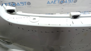 Bare front bumper for a Land Rover Range Rover Velar 18-20 with parking sensors and without Park Assist, white, scratches, chips, pinched, cracked