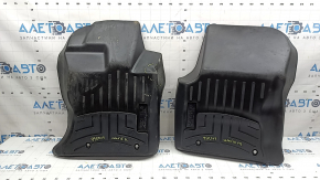 A set of floor mats for the Land Rover Range Rover Velar, black rubber, Weathertech 18-26, with a dented driver's mat.